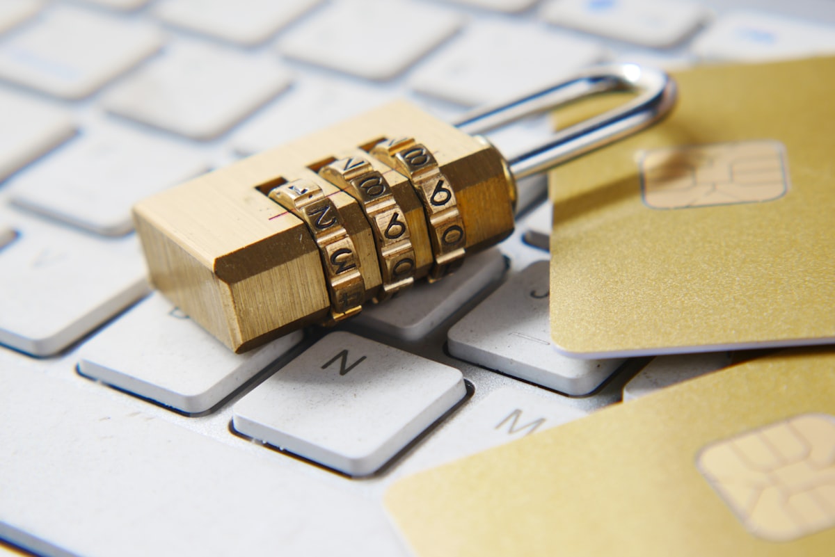 Combination lock and payment cards placed on a computer keyboard
