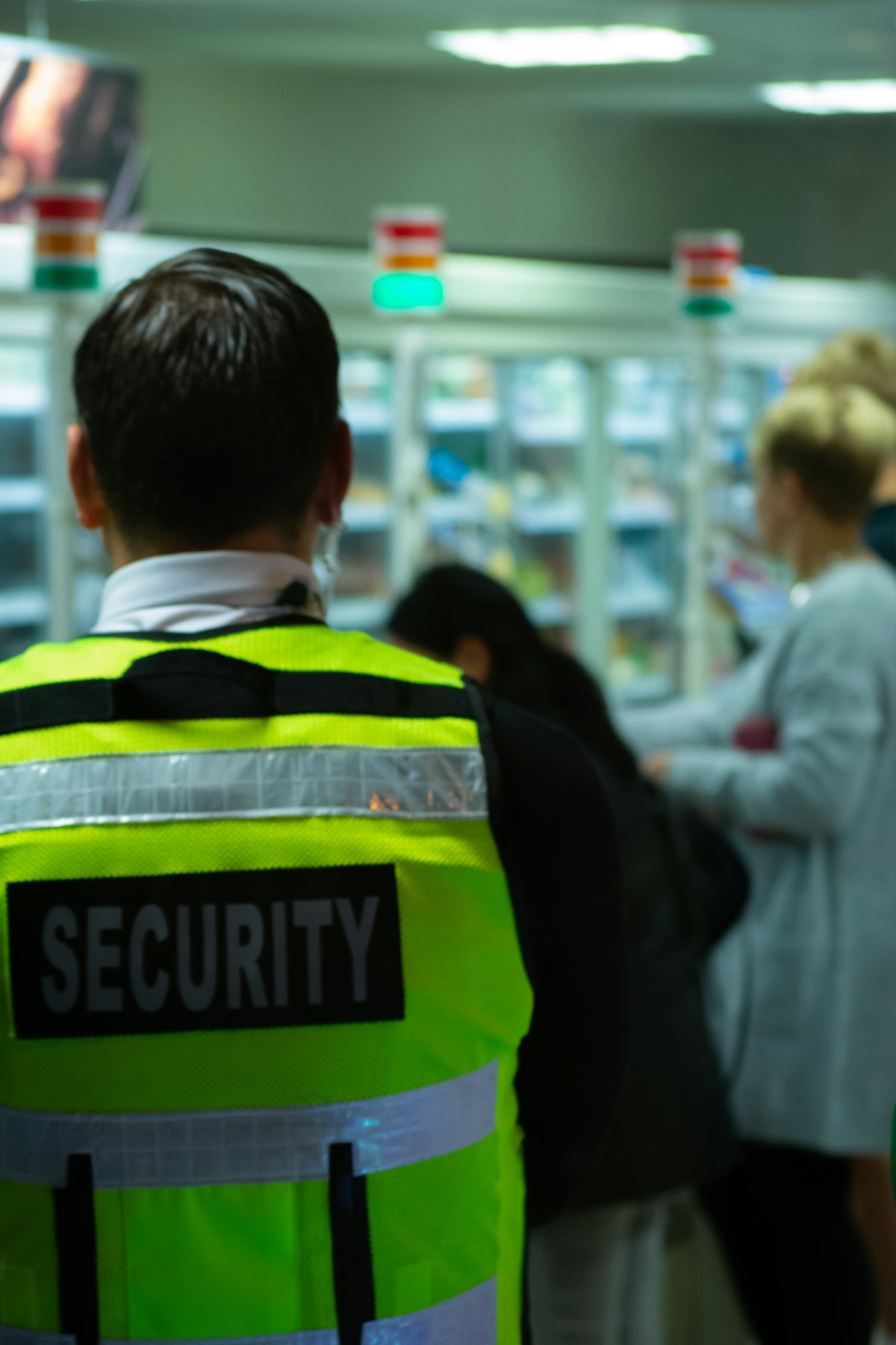 Security officer monitoring a busy public interior